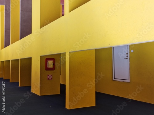 Italy. contemporary architecture in a building of Milan.  Yellow colored walls