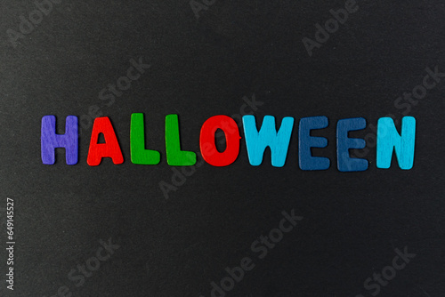 colorful letters with the word Halloween on a black background
