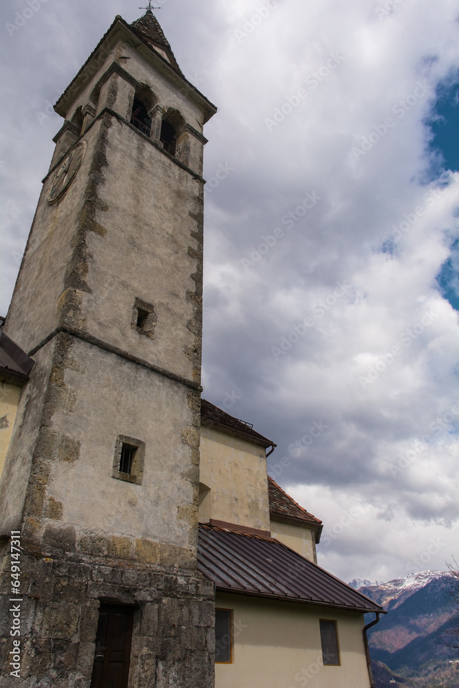 The 15th century St Catherine’s Church in the mountain village of Luint in Carnia in Udine Province, Friuli-Venezia Giulia, NE Italy. Chiesa di Santa Caterina in Italian