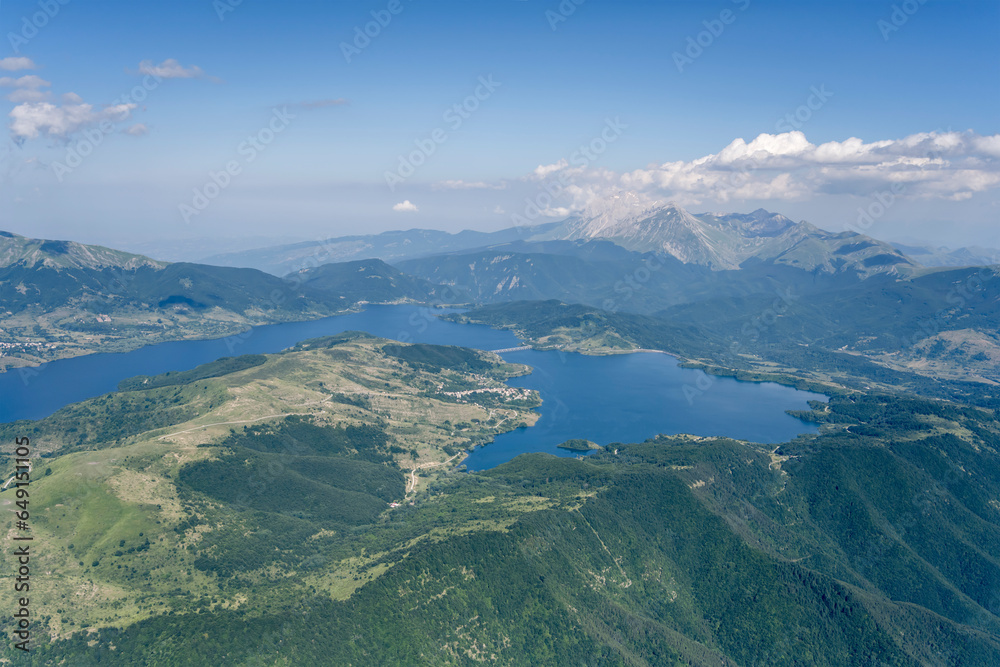 Campotosto lake among green slopes of  hilly upland, Italy