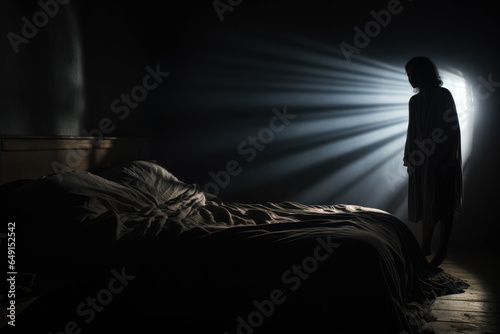 Shadowy figure looming over sleeping figure background with empty space for text 