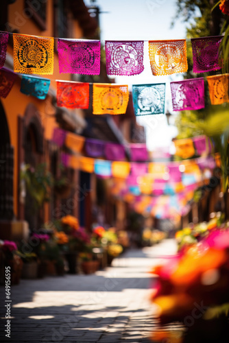 Colorful Papel Picado banners fluttering in Day of the Dead festivities 