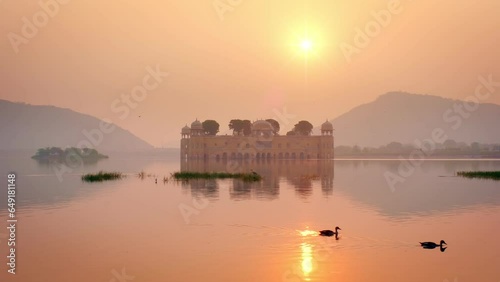 Famous indian tourist landmark Jal Mahal (Water Palace) at sunrise in Jaipur. Ducks and birds around enjoy the serene morning. Jaipur, Rajasthan, India, Asia