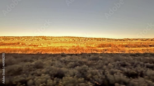 Desert Country.  The view from a train as it crosses desert country on the approach to Gallup in New Mexico in the United States of America.