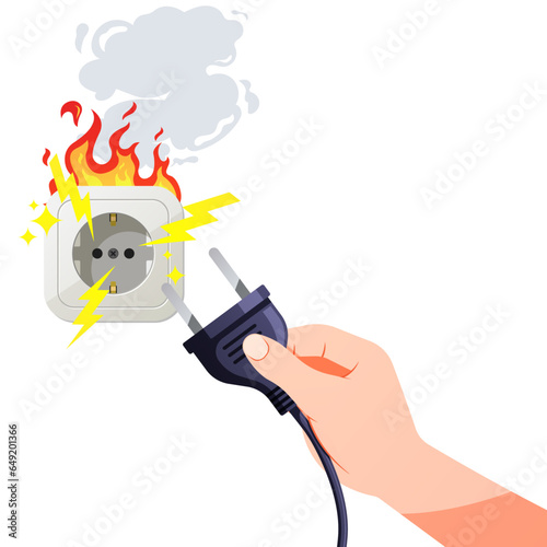 Hand holding plugh.Burnt socket, electric short circuit.