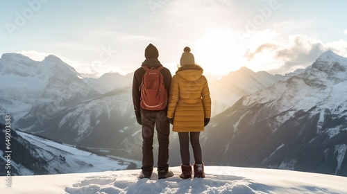 A young couple is enjoying the peak of nature in winter