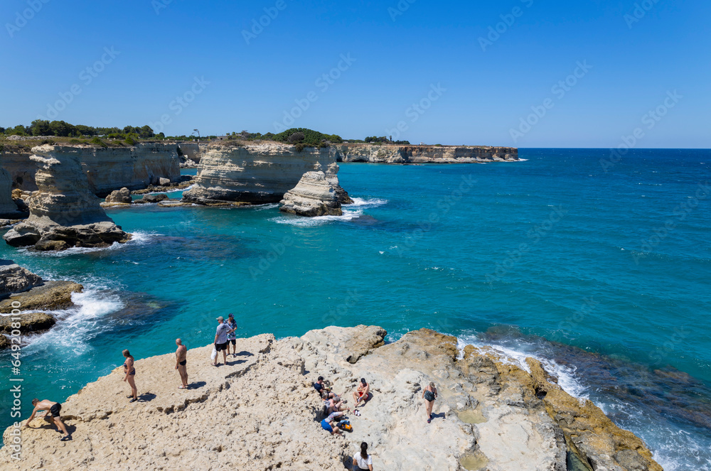 MELENDUGNO, ITALY, JULY 13, 2022 - The cliffs and stacks of Sant'Andrea in Melendugno, region of Salento, province of Lecce, Puglia, Italy