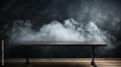 Wooden table with smoke float up on dark background