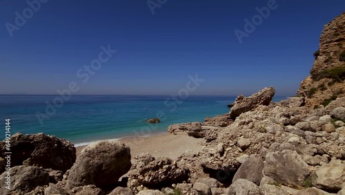 Serene Mediterranean Panorama: Stunning Blue Sea, Rocky Shoreline, and Endless Horizon in a Tranquil Coastal Landscape photo