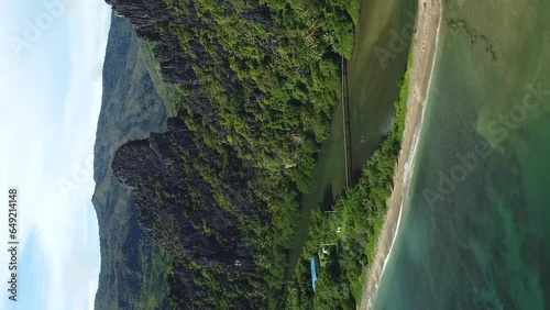 Aerial dolly out of majestic Linderalique rocks near Hienghene, New Caledonia. vertical format photo