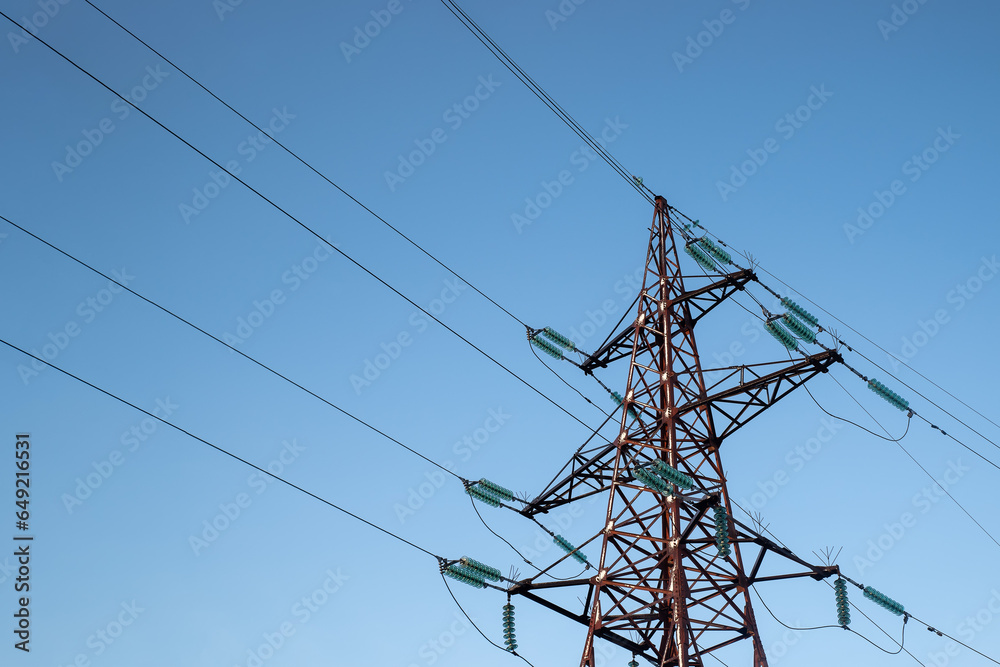 Power line support with wires for electricity transmission. High voltage grid tower with wire cable at distribution station. Energy industry, energy saving. Power line support with wires for electricity transmission. High voltage grid tower with wire cable at distribution station. Energy industry, energy saving.