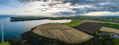 Panorama of Sunset over Fields and Farms from a drone, Monk Haven Beach, Pembrokeshire Coast Path, Haverfordwest, Wales, England photo