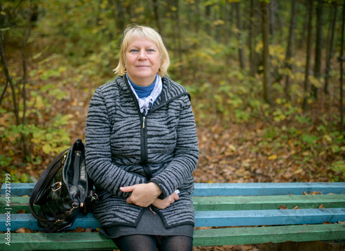 Autumn Portrait of Beautiful Aged Woman. Natural light.
