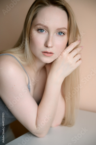 Portrait of a young woman with blue eyes. Natural light.