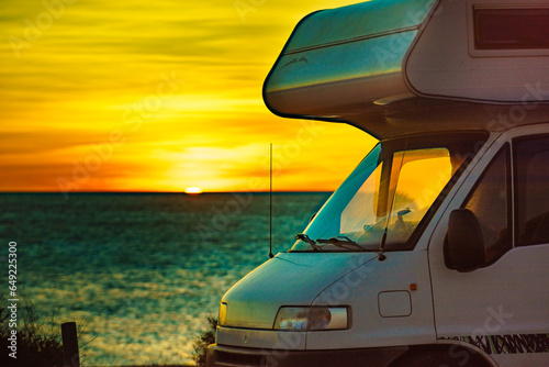 Caravan on beach at sunrise