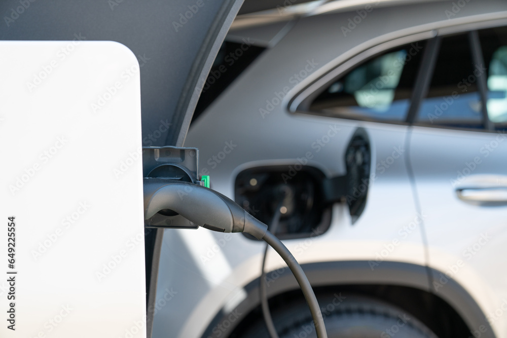 Close-up of an electric car with a cable