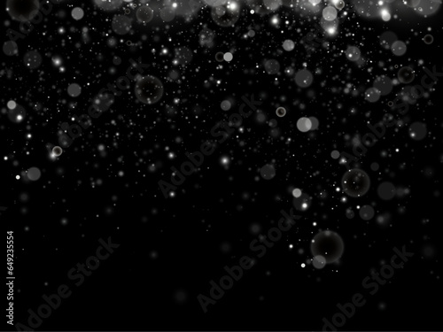Particles of white magic dust. Shining light particles.Christmas glitter particles. Light effect on a transparent background. © kulinskaia