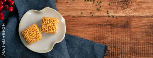 Delicious mung bean moon cake for Mid-Autumn Festival food mooncake on wooden table background. photo