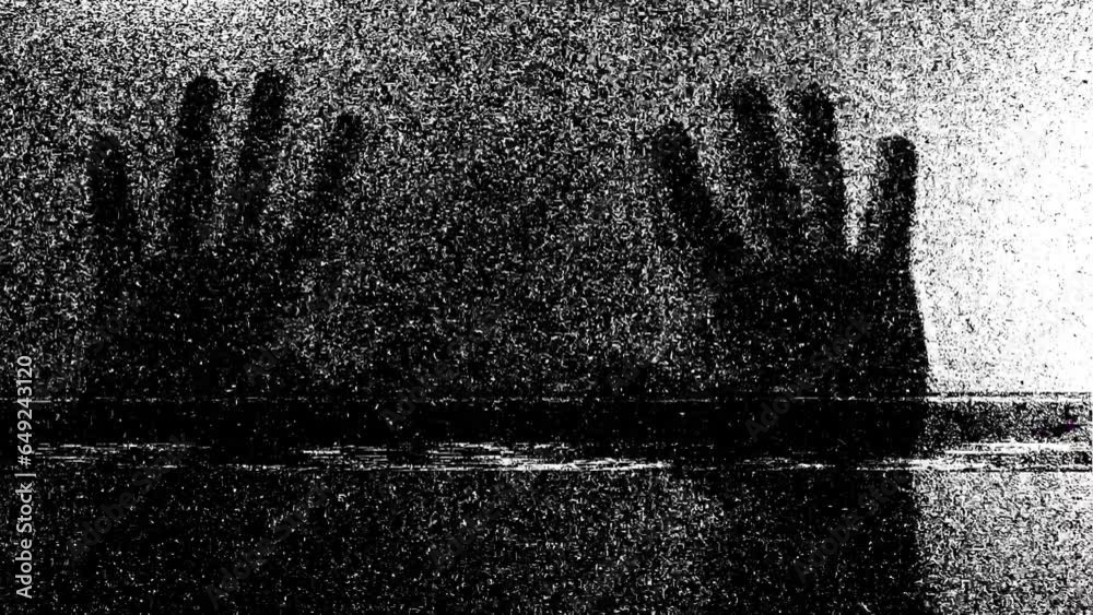 Silhouette of a mad male person or ghost and static tv black and white noise, scary movie tv screen noise