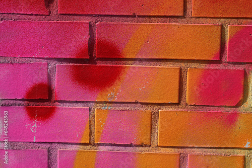 Orangerote Backsteinmauer mit roten Farbtupfern, Hintergrund, Deutschland photo