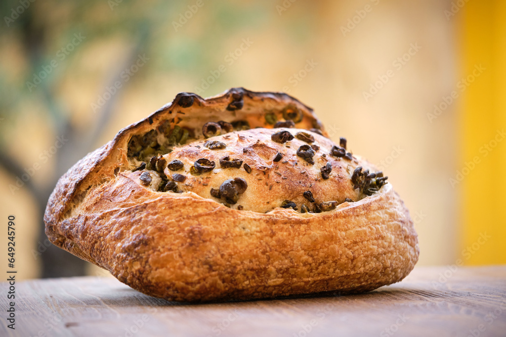Delicious freshly baked rustic bread with olives