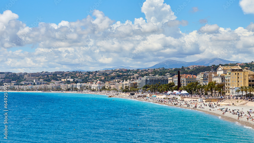 Panoramic view of Nice coastline and beach with blue sky and clouds, Provence-Alpes-Cote d'Azur, France, The French Riviera.