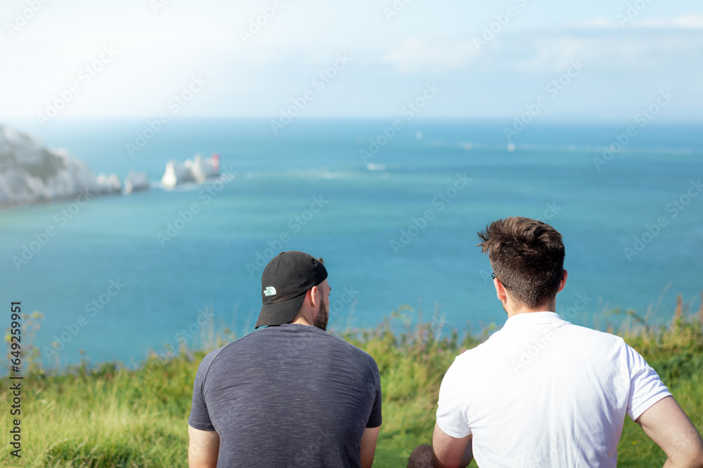 Fototapeta premium Two men hiking on a coastal path