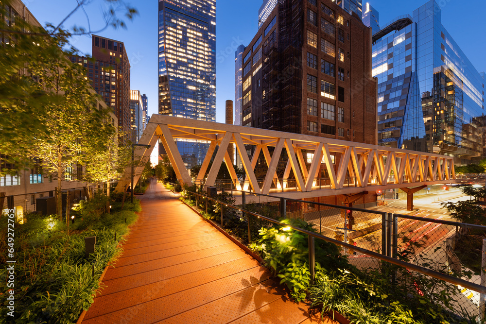 High Line Park timber wooden truss bridge in evening with Hudson Yards skyscrapers. This new section opened in 2023. Chelsea, Manhattan, New York City - obrazy, fototapety, plakaty 