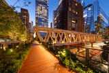 High Line Park timber wooden truss bridge in evening with Hudson Yards skyscrapers. This new section opened in 2023. Chelsea, Manhattan, New York City