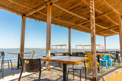 Fototapeta Naklejka Na Ścianę i Meble -  Cozy beach restaurant on the shore of the lake.