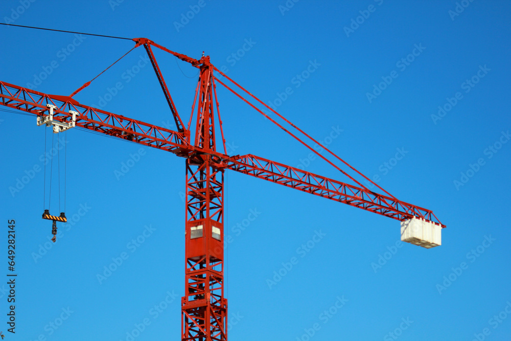 red crane over blue sky