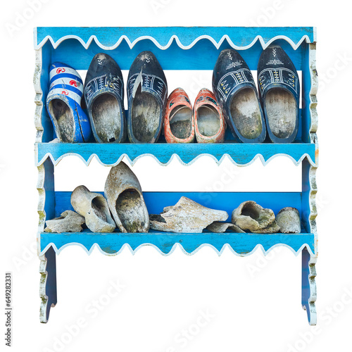 Old cabinet with weathered vintage Dutch wooden clogs