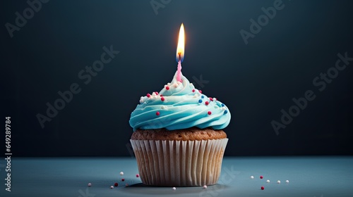 A cupcake with a candle that says birthday on it © Berkahmu