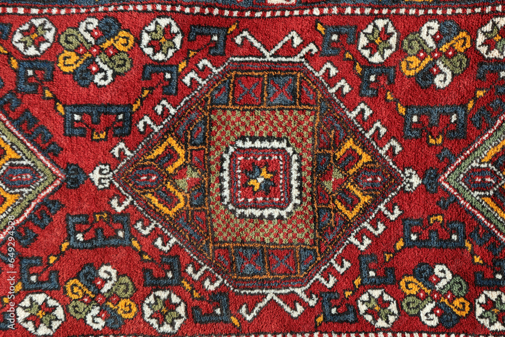 Detail from a traditional Turkish carpet. Hand-woven carpets belong to the late 20th century. Natural dyes and wool yarn were used in the production of the carpet.