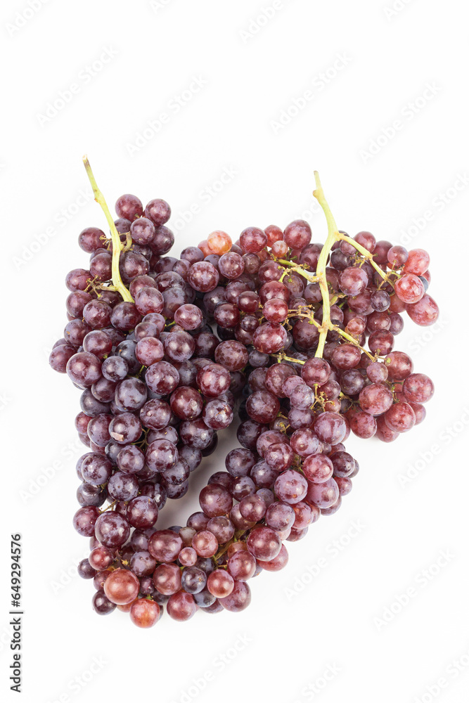 bunch of red grapes on white background - food and drink concept