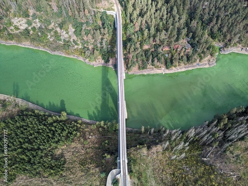 The Hracholusky dam with water power plant. The water reservoir on the river Mze. Source of renewable energy and popular recreational area in Western Bohemia. Czech Republic, Europe. green water
 photo