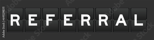 Black color analog flip board with word referral on gray background