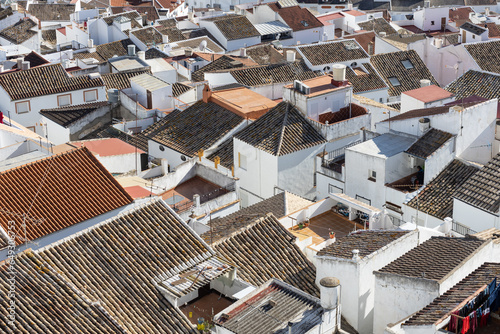 Aerial panoramic view of rooftops of white houses of Olvera town, considered the gate of white towns route in the province of Cadiz, Spain.