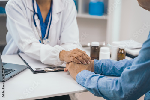 Elderly patient asian people attentively listening to mature doctor  receiving valuable health advice and discussing comprehensive health results in caring medical environment. Health Consultation