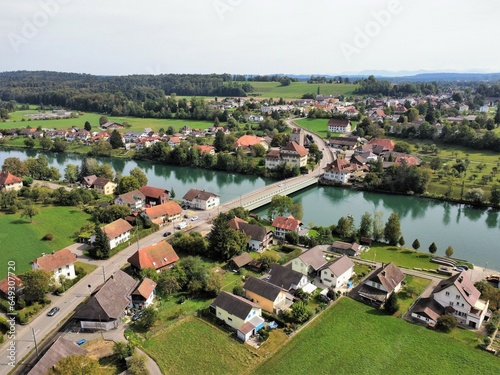 View of the Aarwangen village with a bridge across the Aare river, canton of Bern, Switzerland. Aerial view