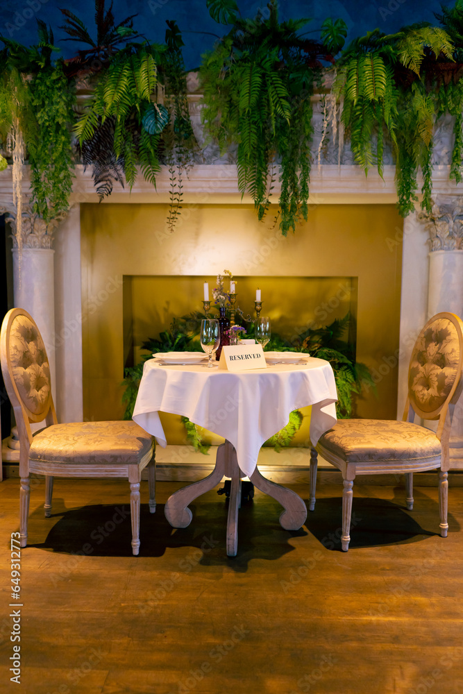 Close-up of a reservation sign reserved  standing on a table in an expensive luxury Italian restaurant