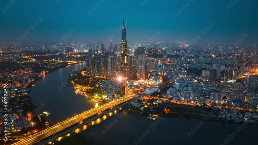 Aerial cityscape view of HoChiMinh city and the River Saigon, Vietnam with blue sky. Financial and business centers in developed Vietnam. Aerial cityscape view of HoChiMinh city and the River Saigon, Vietnam with blue sky. Financial and business centers in developed Vietnam.