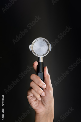 Close-up of hand holding a portafilter