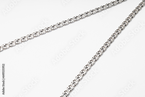 Silver chain on white background, subject macro photography