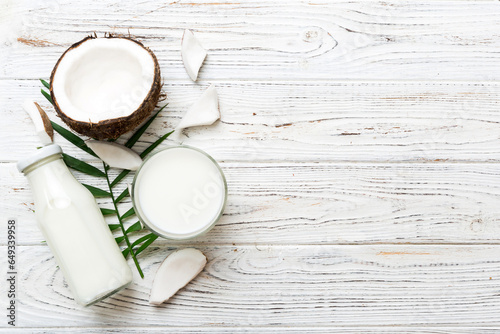 coconut products on white wooden table background. Dairy free milk substitute drink  Flat lay healthy eating