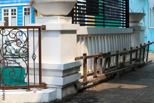 Old concrete fence and railings in the city 