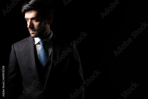 Leader Successful Confident Executive Businessman on black background Businessman wearing suit looking at copy space Confidence Ceo young business man wear formal suit Handsome guy is professional