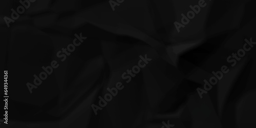 Dark crumple black paper wrinkled poster template ,blank glued creased paper texture background. black paper crumled backdrop background. used for cardboard and clarkboard.
