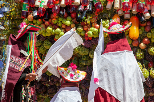 indigenous dressed with traditional clothes in front of Pukara during Pujillay festival in Tarabuco, Bolivia photo