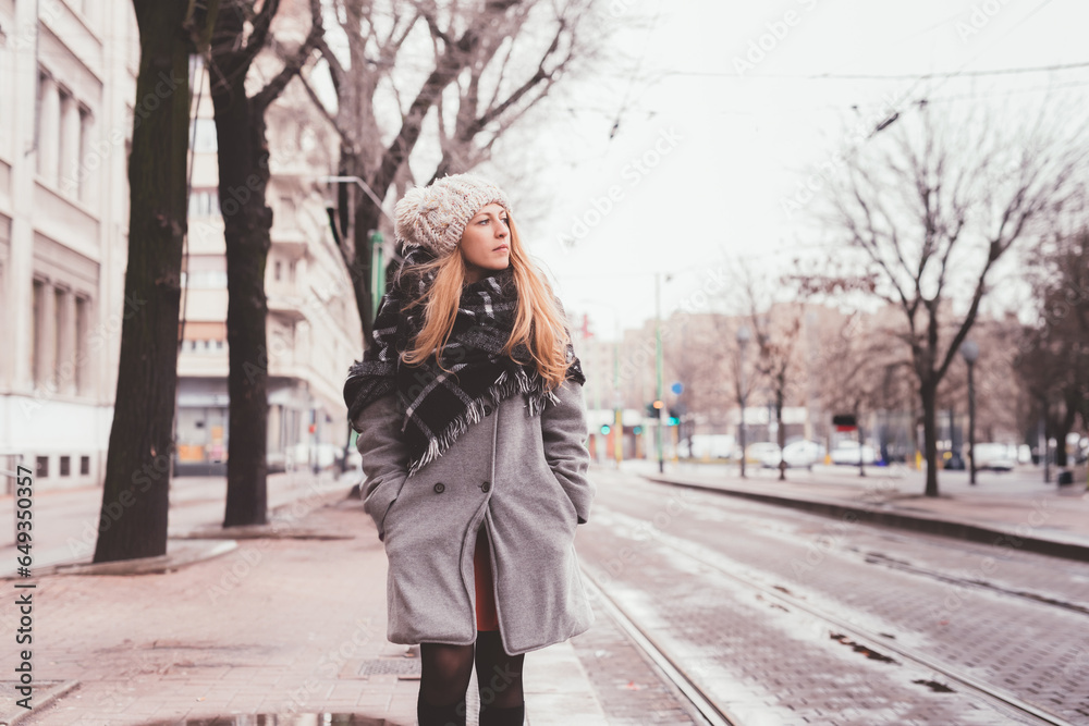 young beautiful woman standing bus stop